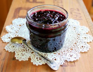 Jar of huckleberry sauce made with black huckleberries